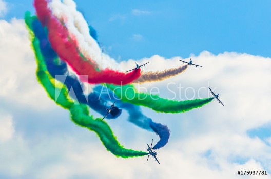 Picture of Airplane group fighter against the background of color smoke